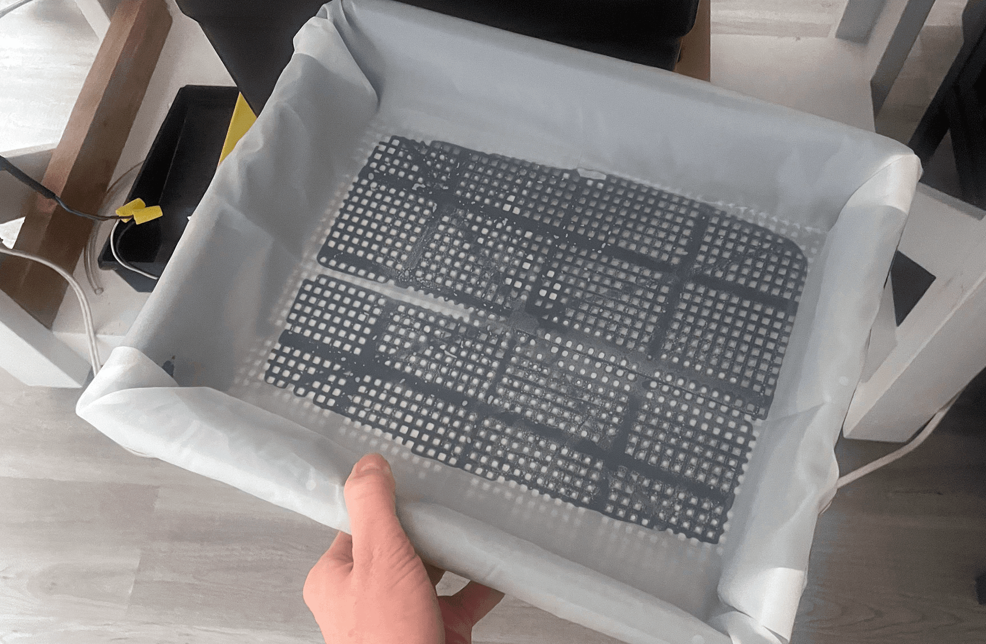 Filter mesh tapped to plastic tray