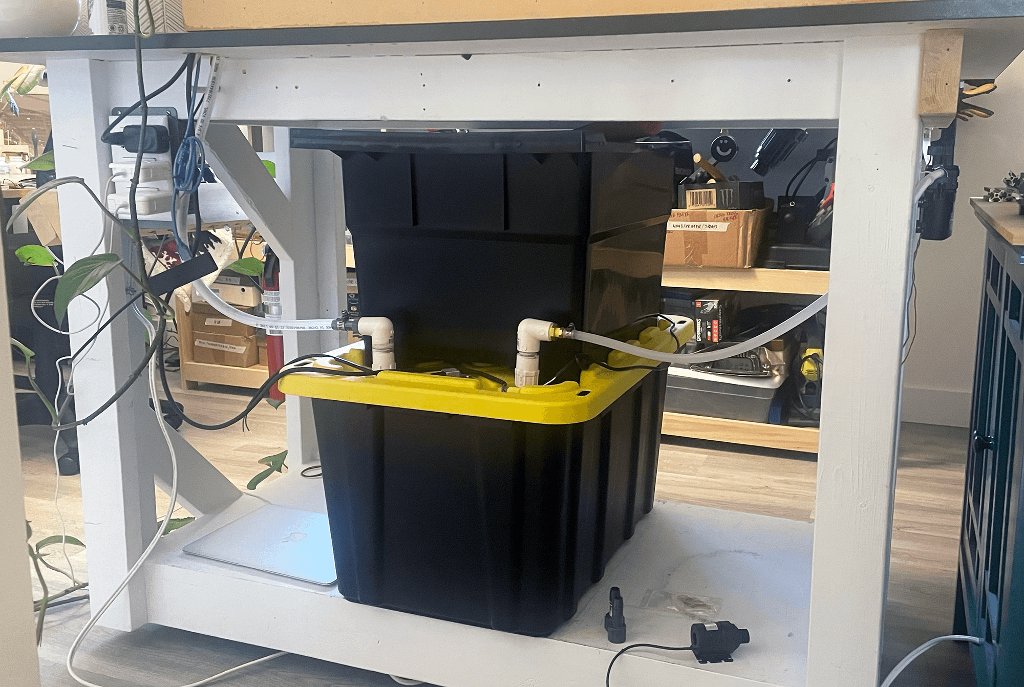 Final setup of stacked laundry tub and reservoir under CNC table