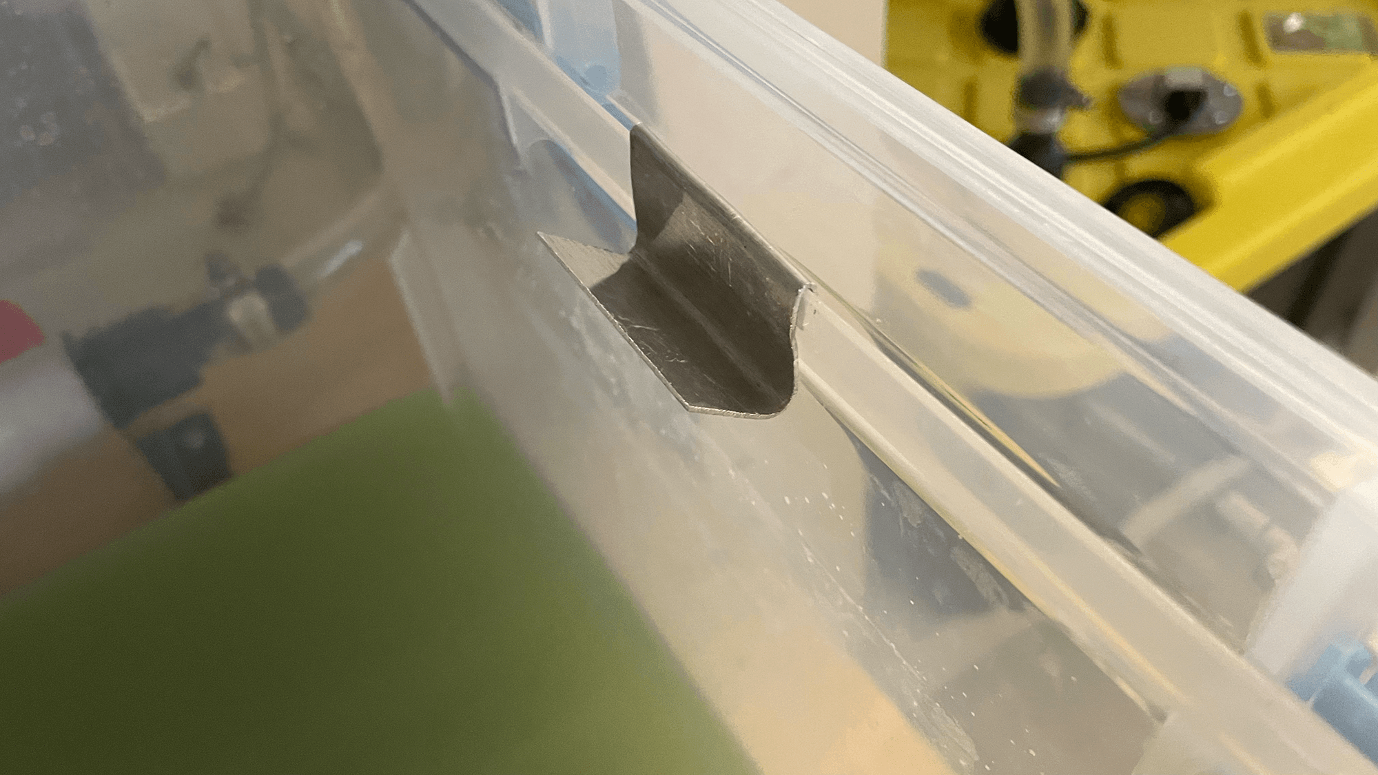 S-hook hanger on catch basin interior rim