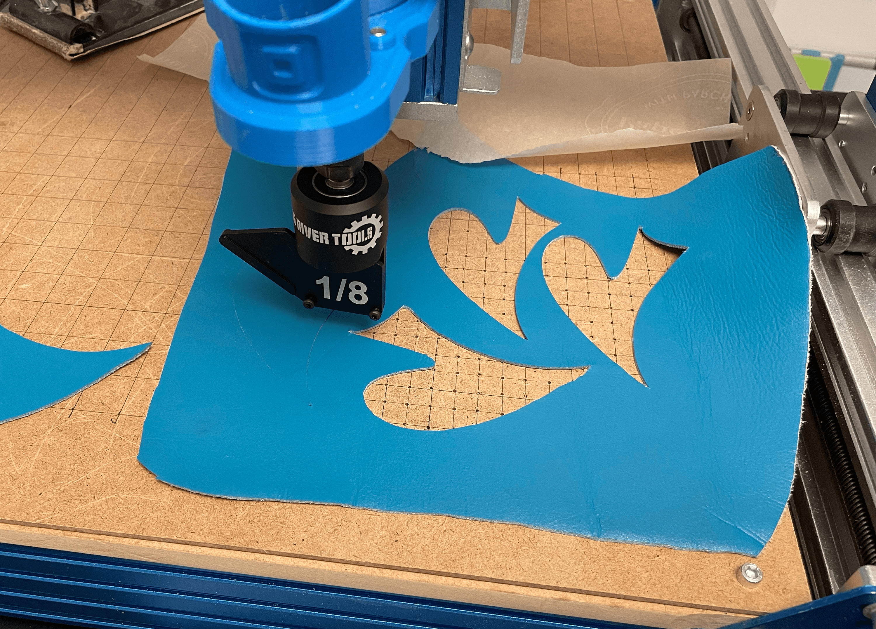 Drag knife cutting leather on a vacuum box